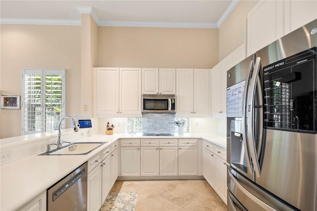 11196 Sea Grass Cir, Boca Raton, FL 33498 - kitchen with appliances with stainless steel finishes, ornamental molding, decorative backsplash, light countertops, and white cabinetry