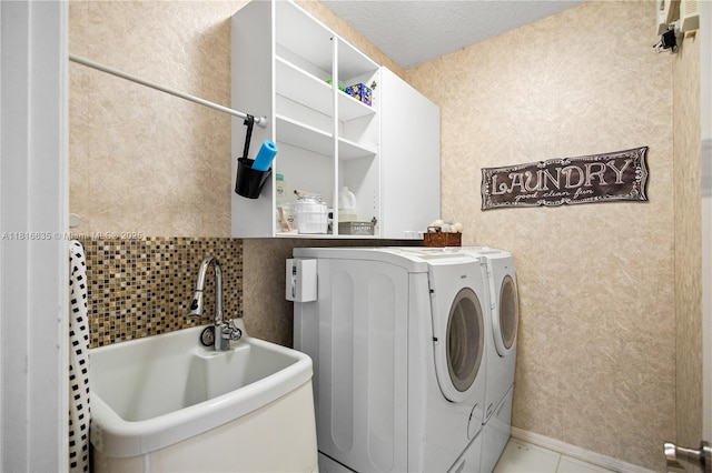 11196 Sea Grass Cir, Boca Raton, FL 33498 - laundry area with washer and clothes dryer and tile patterned floors