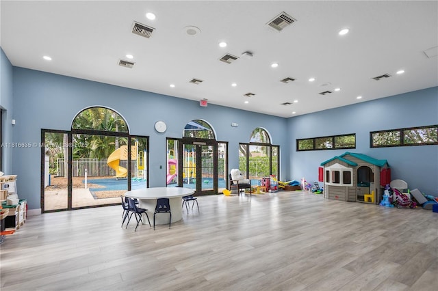 11196 Sea Grass Cir, Boca Raton, FL 33498 - rec room featuring light wood-type flooring, recessed lighting, healthy amount of natural light, and a towering ceiling