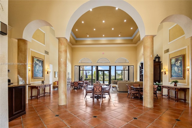 11196 Sea Grass Cir, Boca Raton, FL 33498 - building lobby featuring a towering ceiling, ornamental molding, and recessed lighting