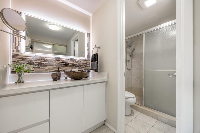 400 Diplomat Pkwy Unit 302, Hallandale Beach, FL 33009 - bathroom featuring decorative backsplash, a stall shower, vanity, and tile patterned floors