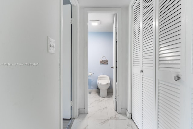 400 Diplomat Pkwy Unit 302, Hallandale Beach, FL 33009 - corridor featuring light marble finish floors and baseboards