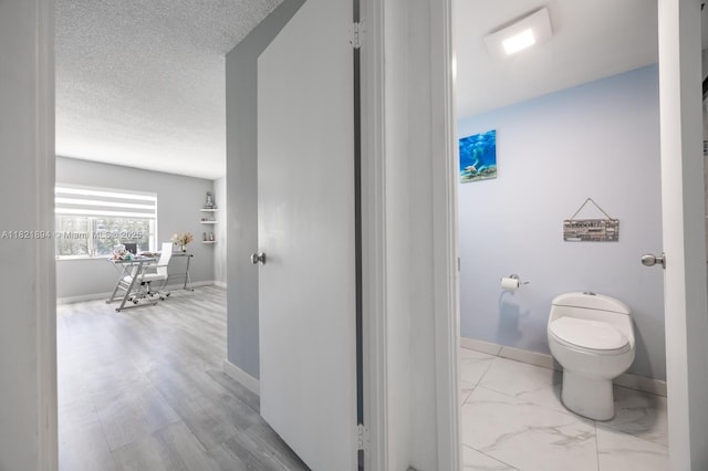 400 Diplomat Pkwy Unit 302, Hallandale Beach, FL 33009 - bathroom with toilet and baseboards
