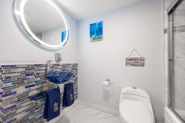 400 Diplomat Pkwy Unit 302, Hallandale Beach, FL 33009 - bathroom with a shower with door and marble finish flooring