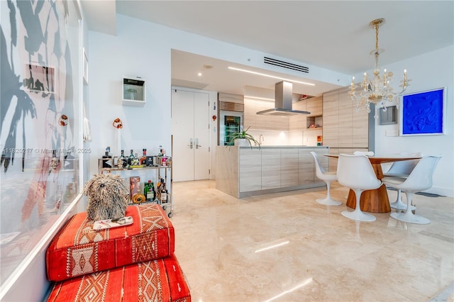 901 Brickell Key Blvd Unit 2602, Miami, FL 33131 - dining room with a chandelier, light marble finish flooring, and wine cooler