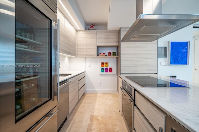901 Brickell Key Blvd Unit 2602, Miami, FL 33131 - kitchen featuring wall chimney exhaust hood, modern cabinets, appliances with stainless steel finishes, and light stone counters