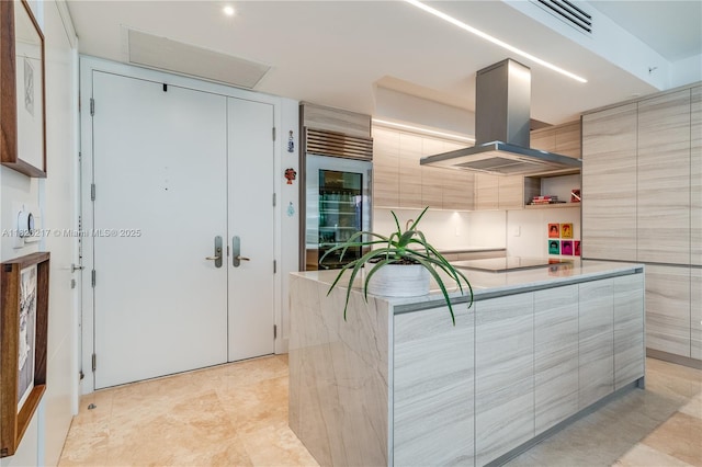 901 Brickell Key Blvd Unit 2602, Miami, FL 33131 - kitchen with island exhaust hood, modern cabinets, open shelves, black electric stovetop, and wine cooler