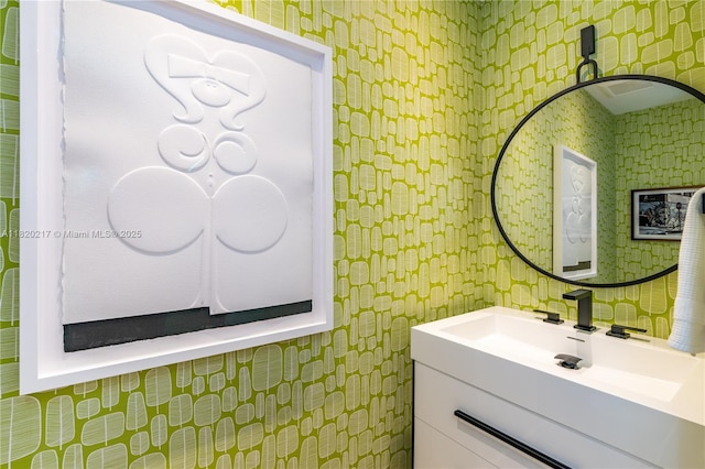 901 Brickell Key Blvd Unit 2602, Miami, FL 33131 - bathroom with wallpapered walls and vanity