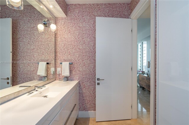 901 Brickell Key Blvd Unit 2602, Miami, FL 33131 - bathroom with wallpapered walls and vanity