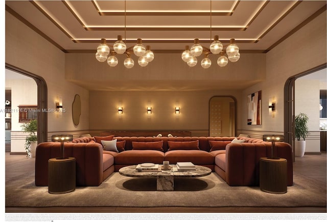 710 NE 29th St Unit 3901, Miami, FL 33137 - carpeted cinema room with arched walkways, a tray ceiling, a towering ceiling, a decorative wall, and wainscoting
