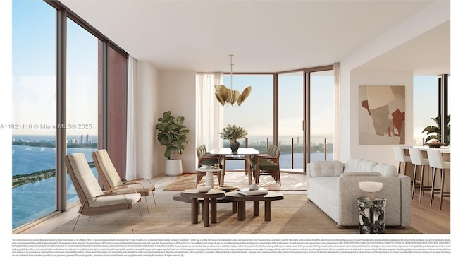 710 NE 29th St Unit 3901, Miami, FL 33137 - living room with a wall of windows, plenty of natural light, wood finished floors, and a water view