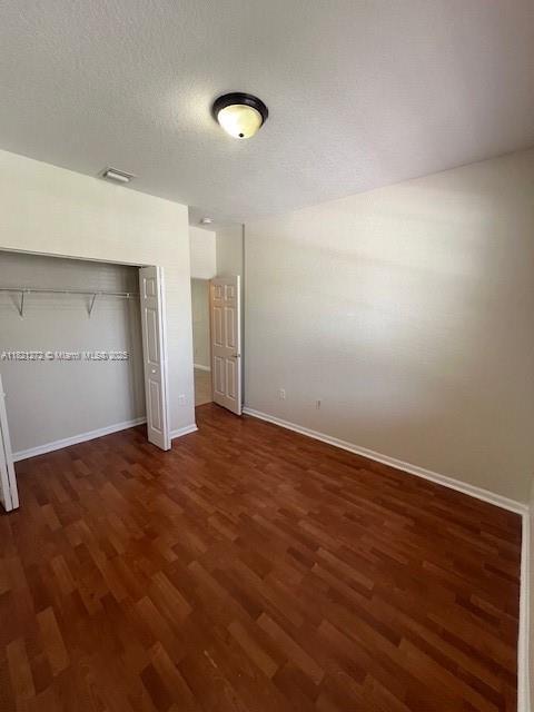 2614 SW 188th Ave, Miramar, FL 33029 - unfurnished bedroom featuring wood finished floors and a closet