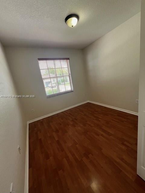 2614 SW 188th Ave, Miramar, FL 33029 - empty room with wood finished floors and a textured ceiling