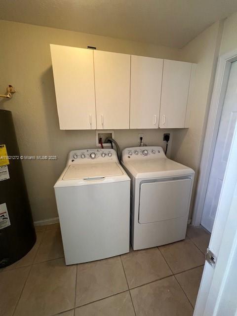 2614 SW 188th Ave, Miramar, FL 33029 - laundry area featuring water heater, cabinet space, independent washer and dryer, and light tile patterned floors