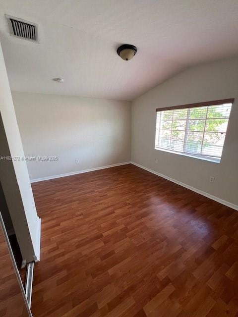 2614 SW 188th Ave, Miramar, FL 33029 - spare room with vaulted ceiling and wood finished floors