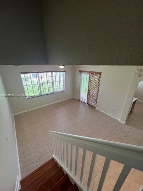 2614 SW 188th Ave, Miramar, FL 33029 - stairway with tile patterned floors and a high ceiling