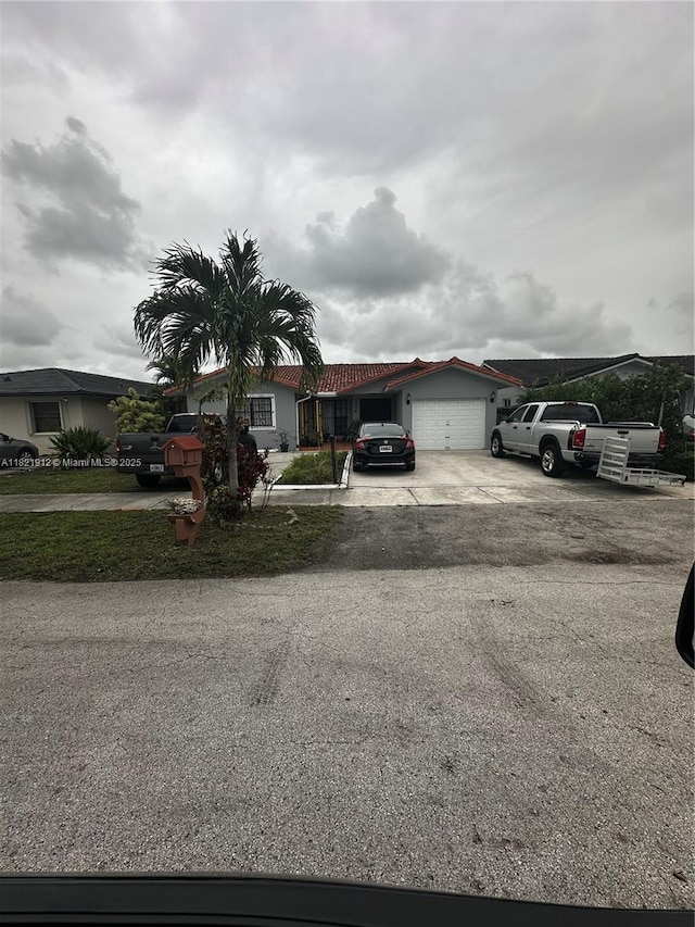 7535 W 5th Ct, Hialeah, FL 33014 - ranch-style home with a garage and driveway