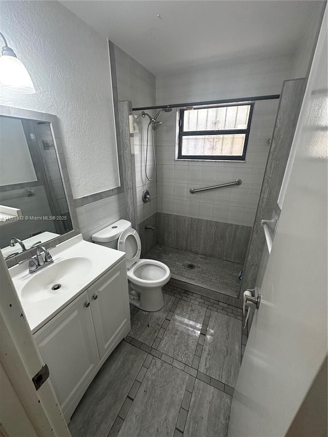 7535 W 5th Ct, Hialeah, FL 33014 - bathroom featuring vanity, a stall shower, and a textured wall