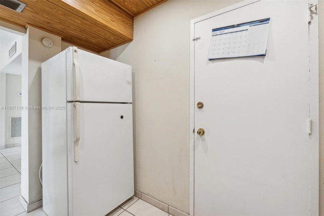 6705 NW 169th St Unit C310, Hialeah, FL 33015 - kitchen featuring freestanding refrigerator and light tile patterned floors