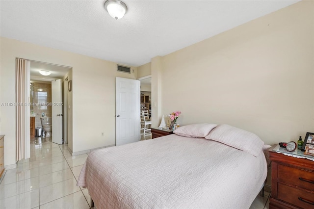 6705 NW 169th St Unit C310, Hialeah, FL 33015 - bedroom with baseboards and light tile patterned floors