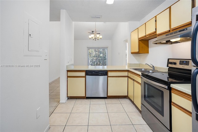 2203 SW 80th Ter Unit 2203, Miramar, FL 33025 - kitchen featuring appliances with stainless steel finishes, under cabinet range hood, light tile patterned floors, and light countertops