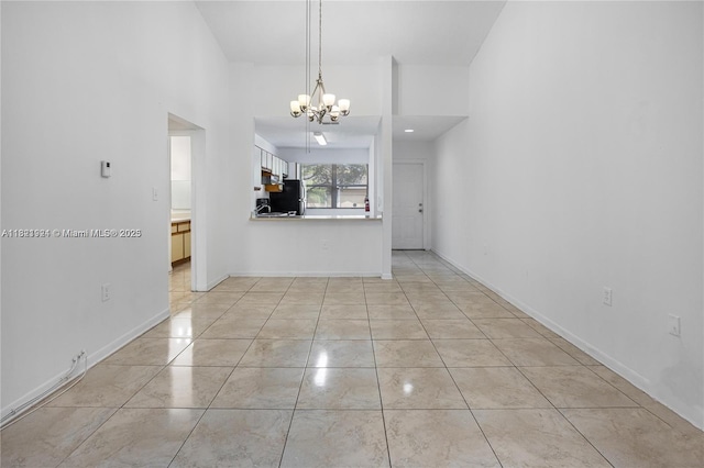 2203 SW 80th Ter Unit 2203, Miramar, FL 33025 - unfurnished living room with a chandelier and baseboards
