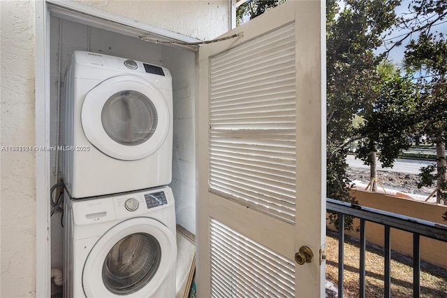 2203 SW 80th Ter Unit 2203, Miramar, FL 33025 - laundry area with stacked washer / drying machine, a textured wall, and healthy amount of natural light