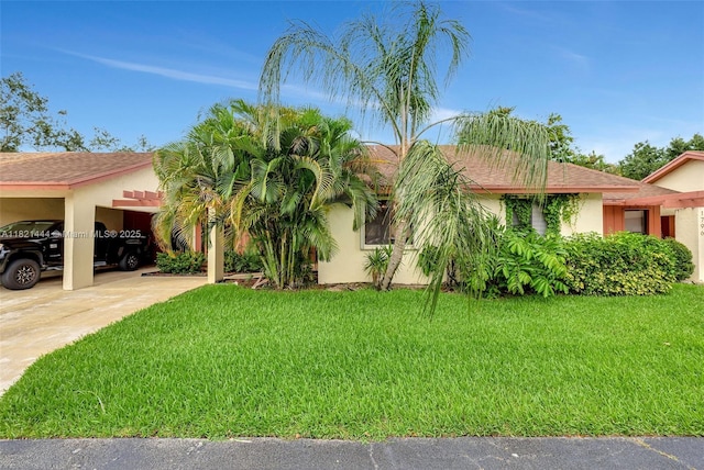 1798 Maplewood Trl, Coconut Creek, FL 33063 - view of front of property featuring a front lawn, an attached carport, stucco siding, and driveway