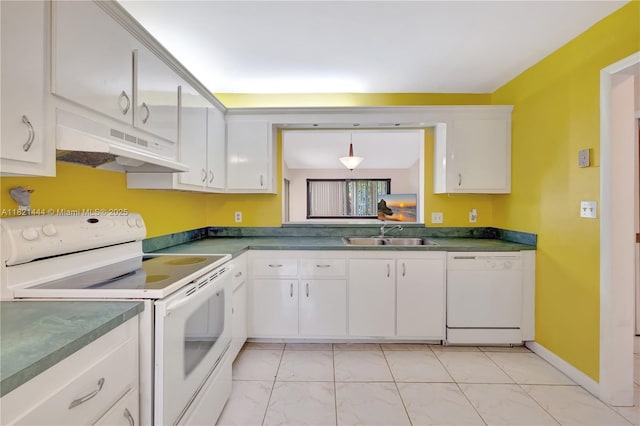 1798 Maplewood Trl, Coconut Creek, FL 33063 - kitchen with white appliances, under cabinet range hood, dark countertops, and white cabinets