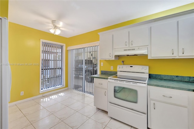 1798 Maplewood Trl, Coconut Creek, FL 33063 - kitchen featuring white range with electric cooktop, under cabinet range hood, dark countertops, and white cabinets
