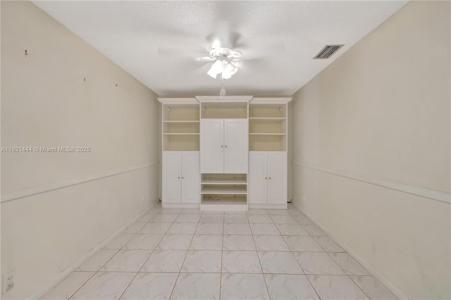1798 Maplewood Trl, Coconut Creek, FL 33063 - unfurnished bedroom with light marble finish floors and a ceiling fan