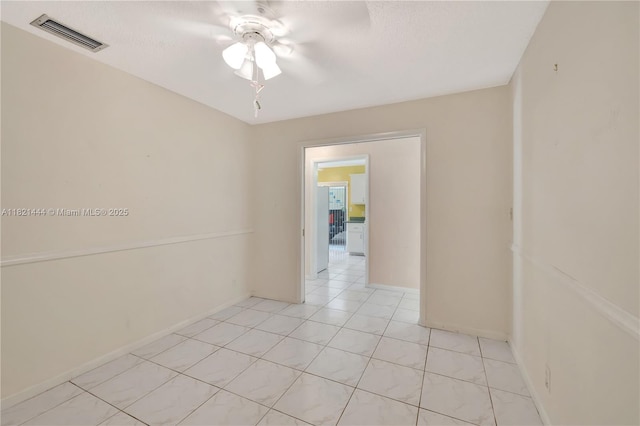 1798 Maplewood Trl, Coconut Creek, FL 33063 - unfurnished room with a ceiling fan, light tile patterned flooring, and a textured ceiling