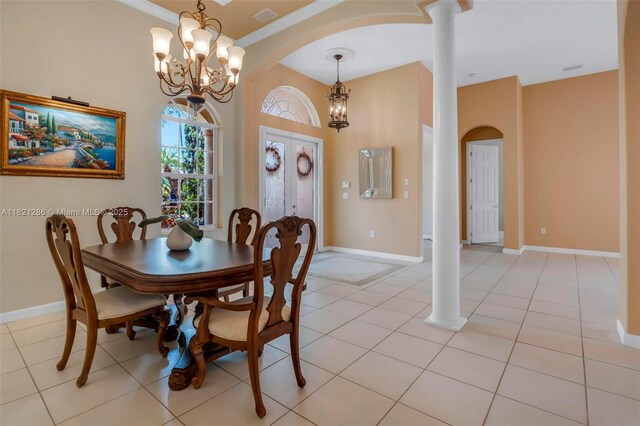 1925 NW 167th Ter, Pembroke Pines, FL 33028 - dining area featuring ornate columns, arched walkways, a chandelier, light tile patterned floors, and french doors