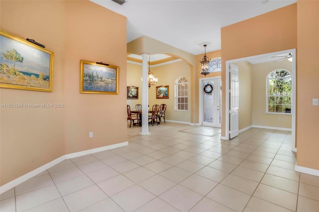 1925 NW 167th Ter, Pembroke Pines, FL 33028 - foyer with a chandelier, arched walkways, light tile patterned flooring, and ornate columns