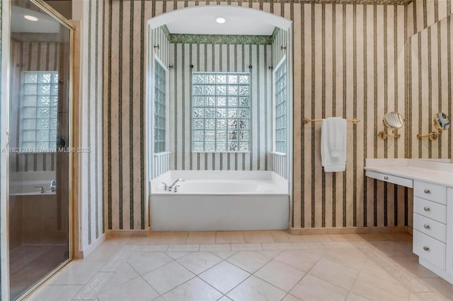 1925 NW 167th Ter, Pembroke Pines, FL 33028 - bathroom featuring a garden tub, vanity, tile patterned flooring, and wallpapered walls