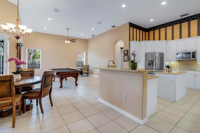 1925 NW 167th Ter, Pembroke Pines, FL 33028 - kitchen featuring stainless steel appliances, arched walkways, a kitchen island, billiards, and a ceiling fan