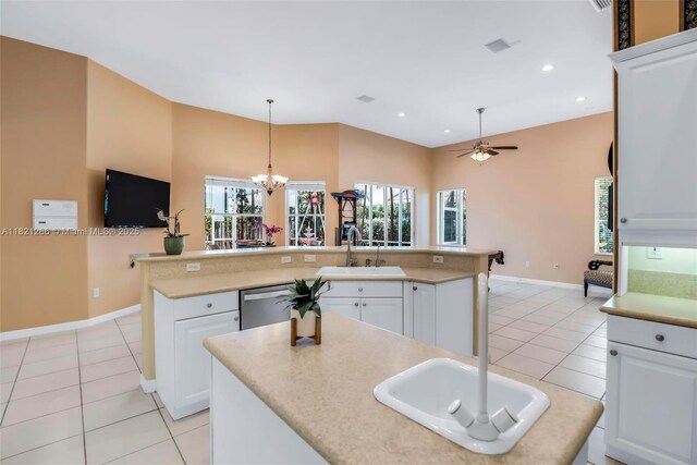 1925 NW 167th Ter, Pembroke Pines, FL 33028 - kitchen featuring stainless steel dishwasher, a kitchen island with sink, light tile patterned flooring, a chandelier, and light countertops