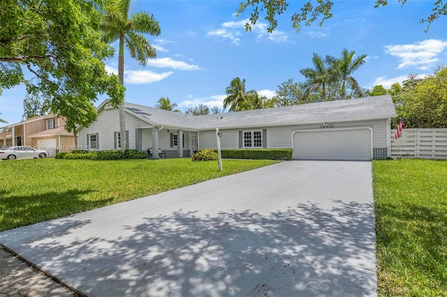 14821 SW 148th St Cir, Miami, FL 33196 - ranch-style home with an attached garage, concrete driveway, and a front yard