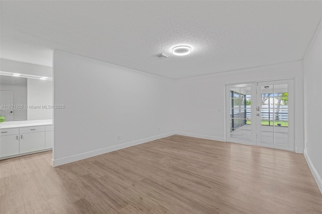 14821 SW 148th St Cir, Miami, FL 33196 - unfurnished room featuring a textured ceiling and light wood finished floors