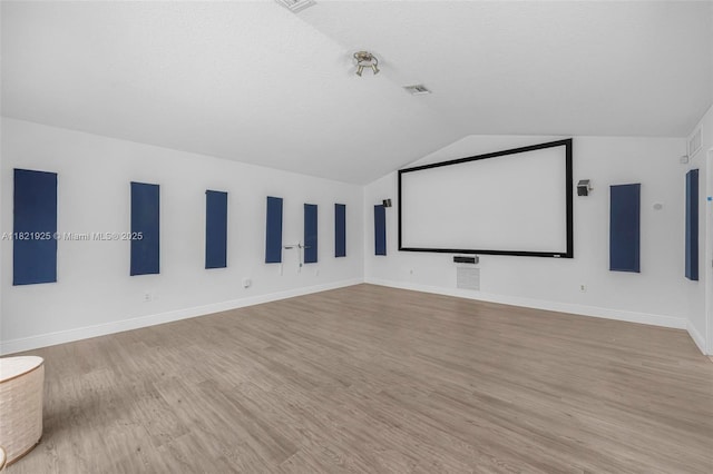 14821 SW 148th St Cir, Miami, FL 33196 - cinema room featuring vaulted ceiling and wood finished floors