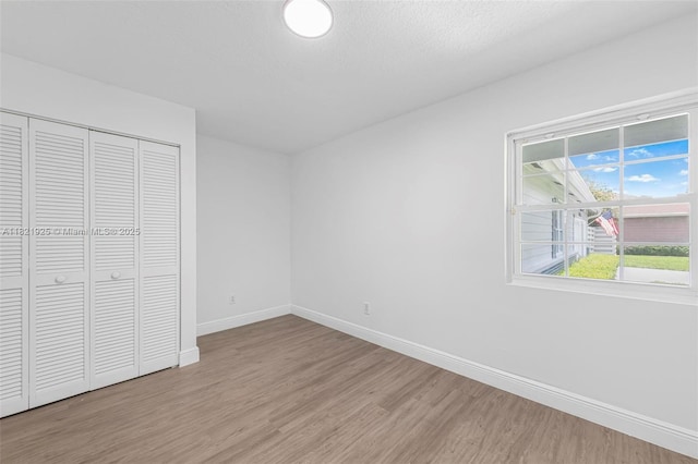 14821 SW 148th St Cir, Miami, FL 33196 - unfurnished bedroom featuring wood finished floors and a closet