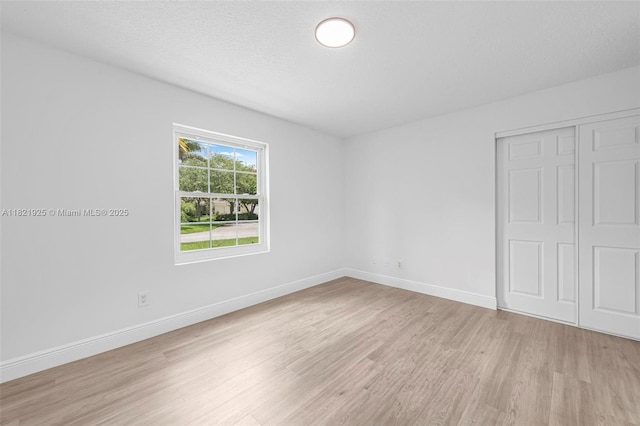 14821 SW 148th St Cir, Miami, FL 33196 - unfurnished bedroom with light wood finished floors and a closet