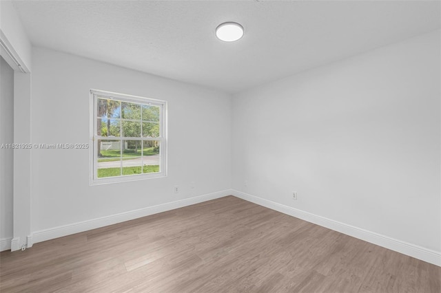 14821 SW 148th St Cir, Miami, FL 33196 - spare room featuring wood finished floors and baseboards