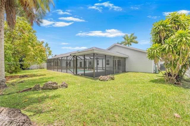 14821 SW 148th St Cir, Miami, FL 33196 - rear view of property featuring a lawn, an outdoor pool, and glass enclosure