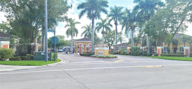 975 NE 42nd Pl, Homestead, FL 33033 - view of asphalt road featuring traffic signs and curbs