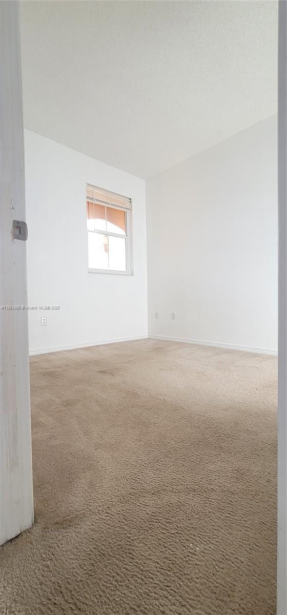 975 NE 42nd Pl, Homestead, FL 33033 - carpeted spare room featuring baseboards