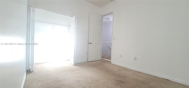 975 NE 42nd Pl, Homestead, FL 33033 - unfurnished bedroom featuring carpet floors and baseboards