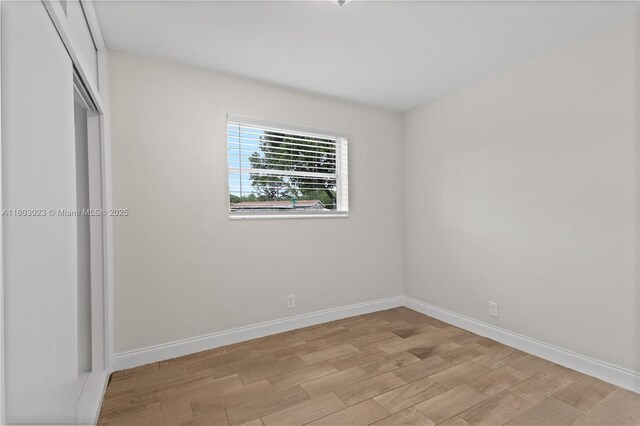 421 SW 64th Ter, Margate, FL 33068 - unfurnished bedroom featuring light wood finished floors and a closet