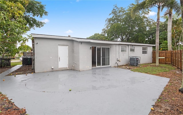 421 SW 64th Ter, Margate, FL 33068 - rear view of property featuring stucco siding and a patio area