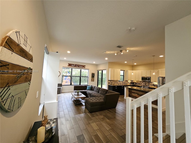 3238 W 96th Pl, Hialeah, FL 33018 - living area with recessed lighting and dark wood-style flooring